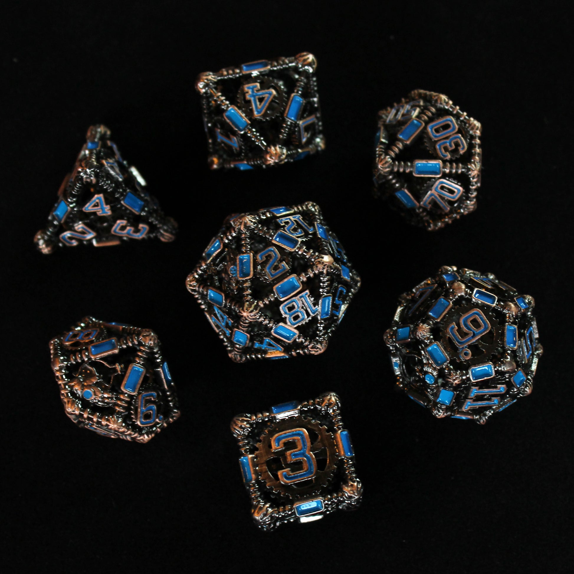All 7 copper and blue dice displayed on a black background. 20 sided die is in the center with the other 6 dice surrounding it in a circle.