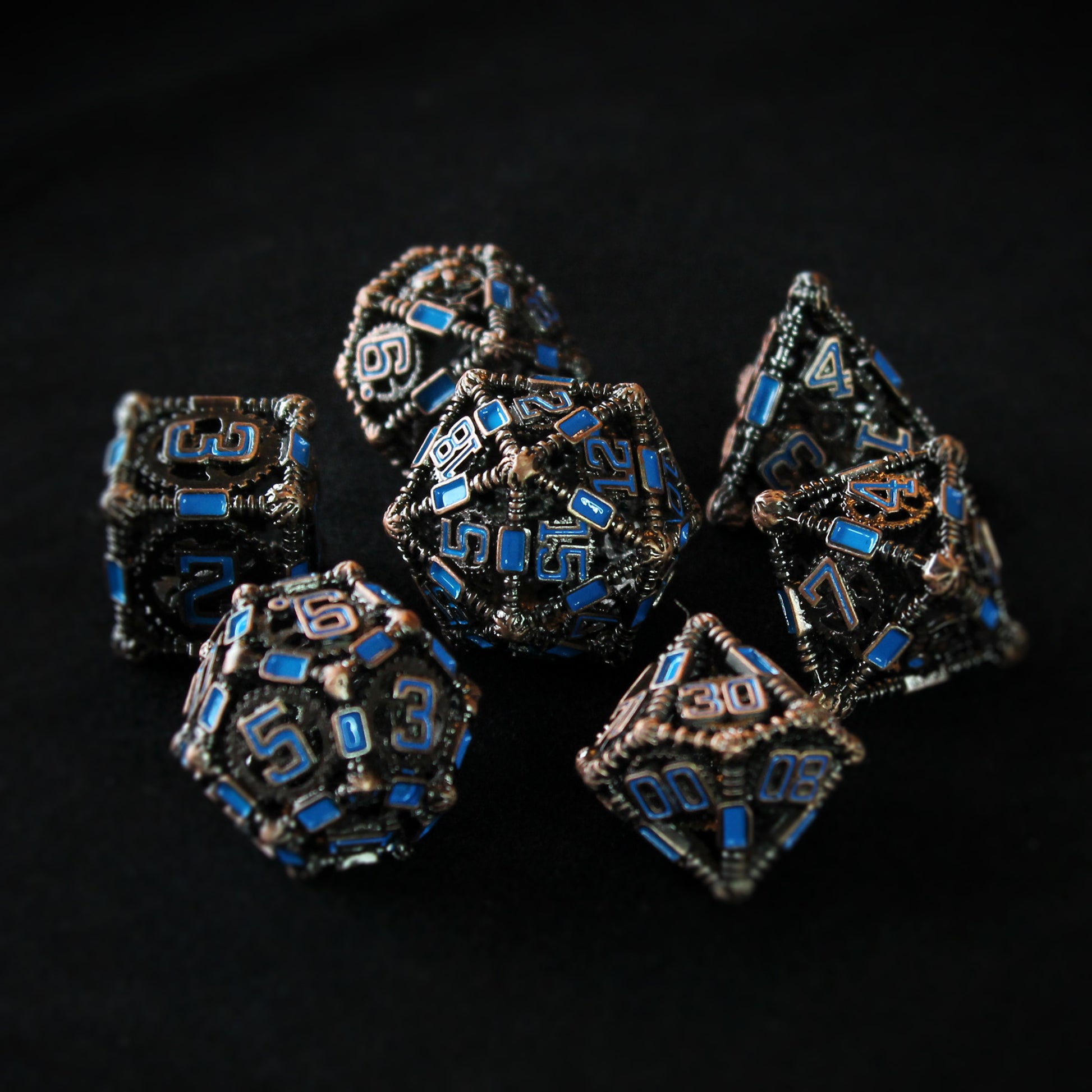 All 7 copper and blue dice displayed on a black background
