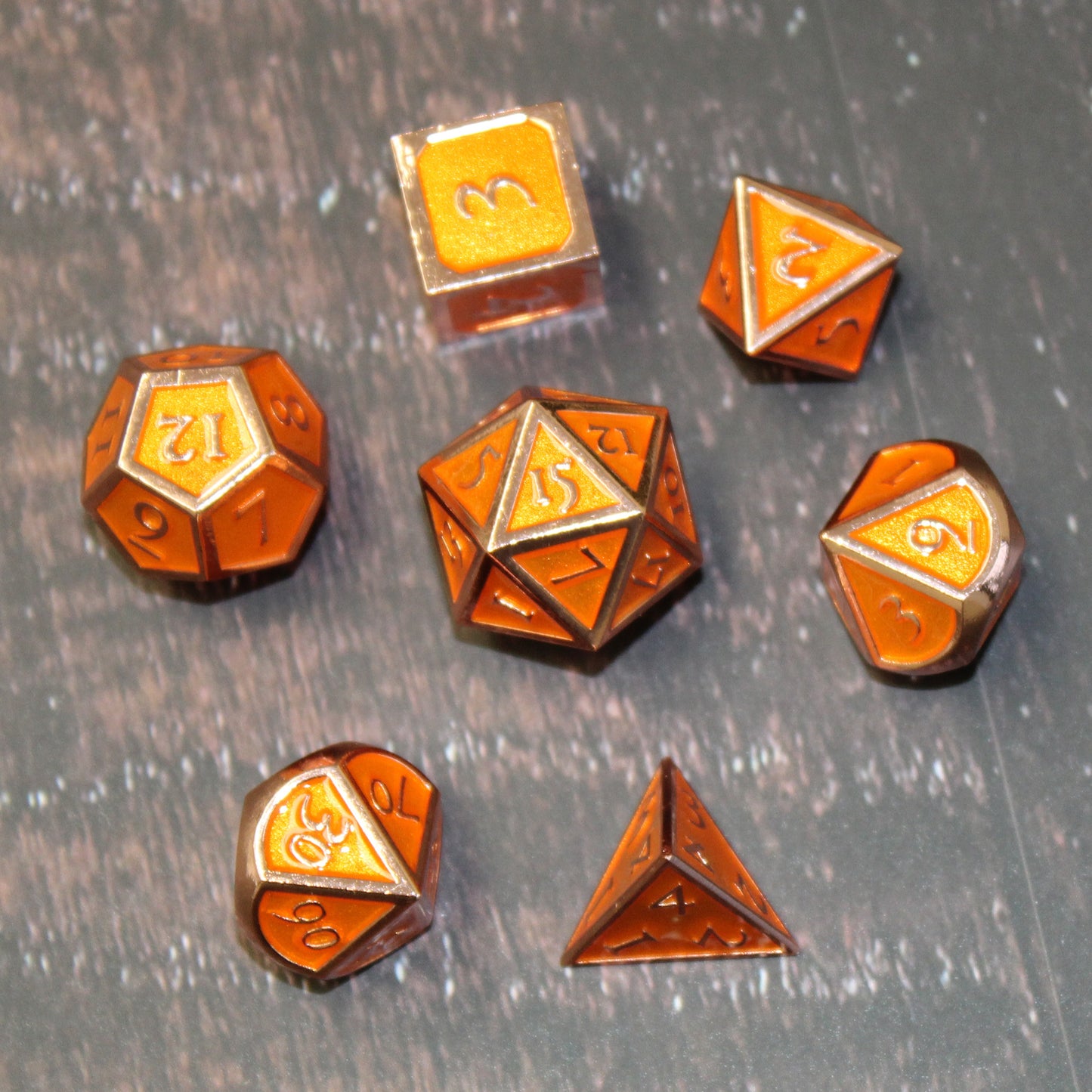 An image looking down at the dice, which are arranged in a circle with the D20 in the center on top of a wooden printed map surface.