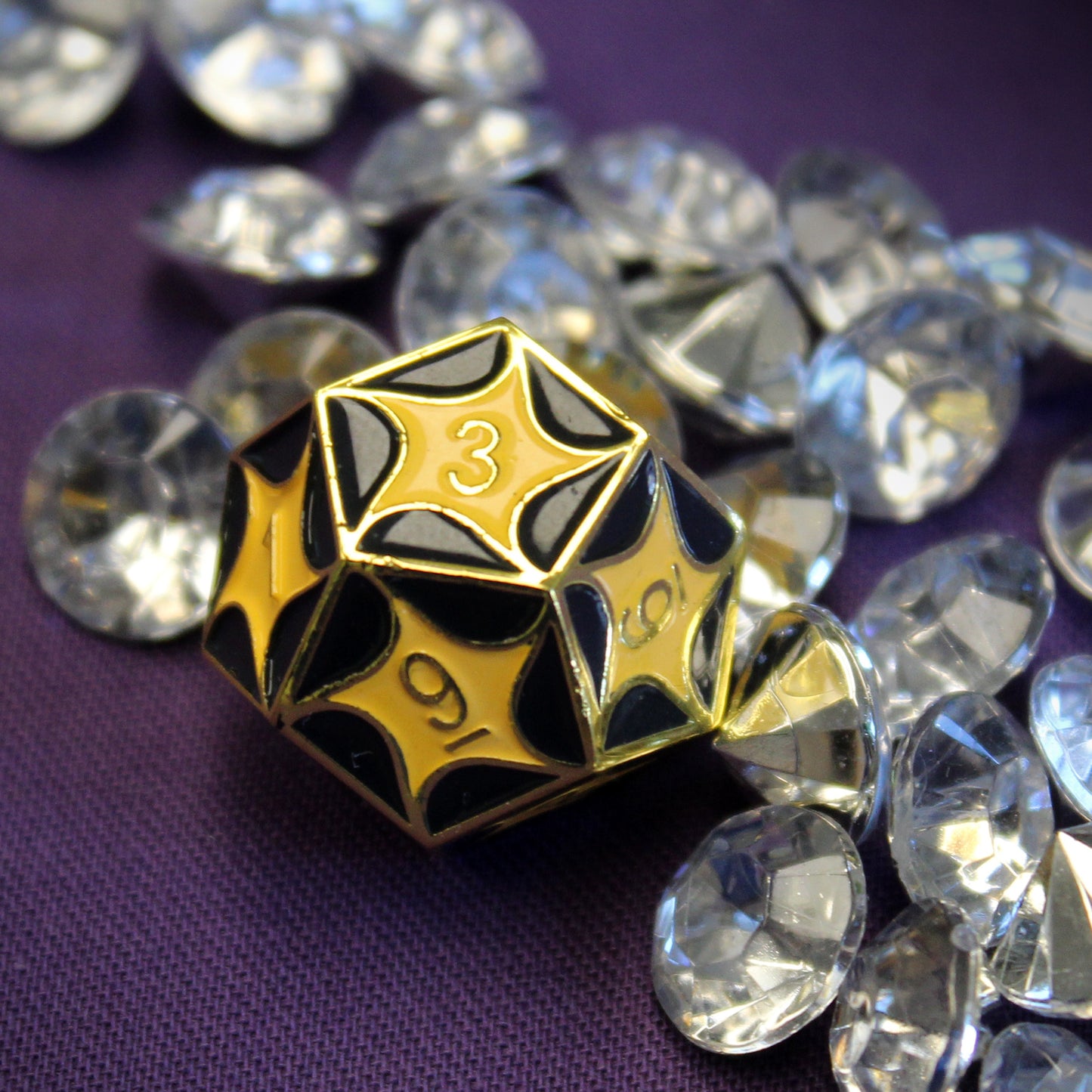 Close-up of the D12 die with intricate dragon scales pattern.