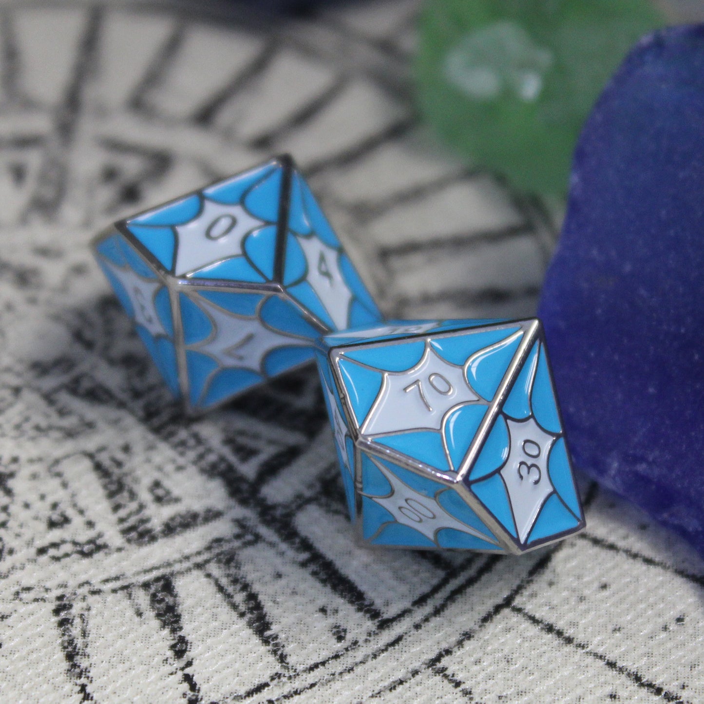 Close-up of D10 and D100 dice with blue dragon scales, perfect for DnD gameplay.