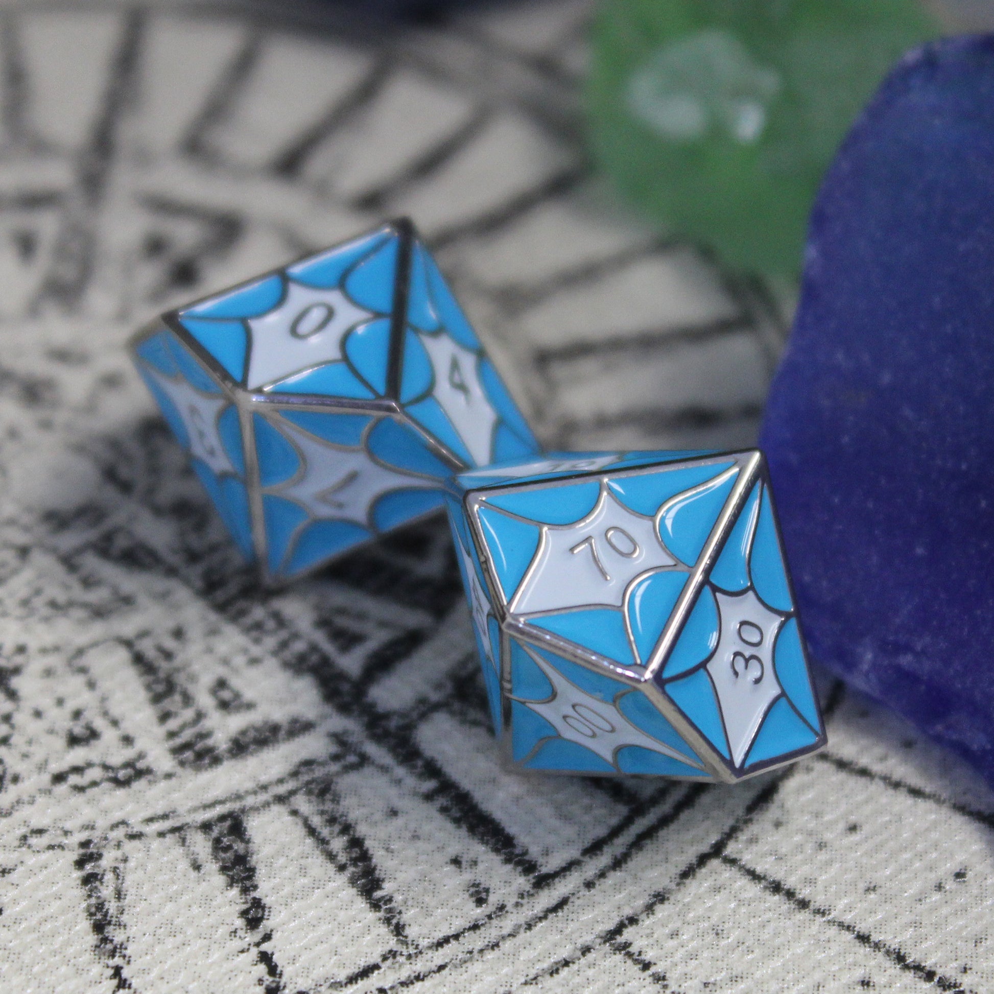 Close-up of D10 and D100 dice with blue dragon scales, perfect for DnD gameplay.