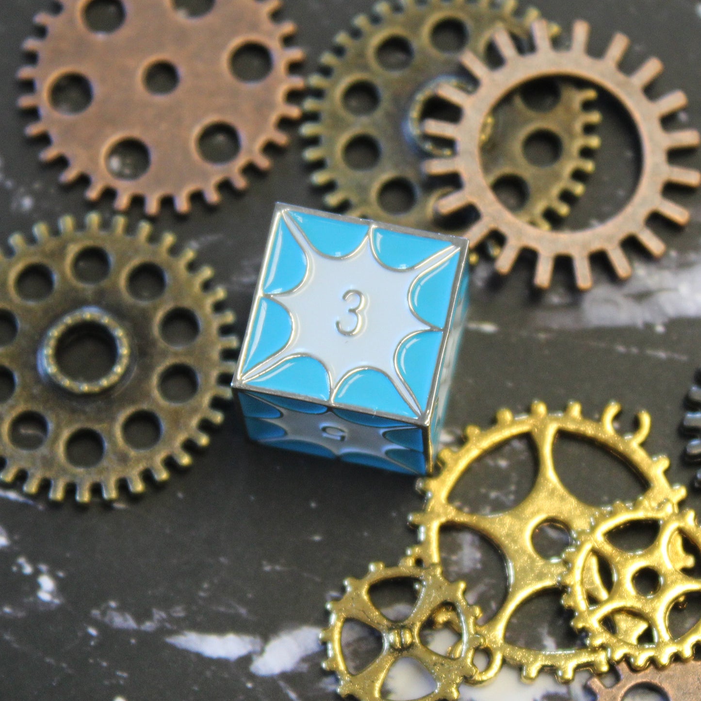 Close-up of D6 die with blue dragon scales.