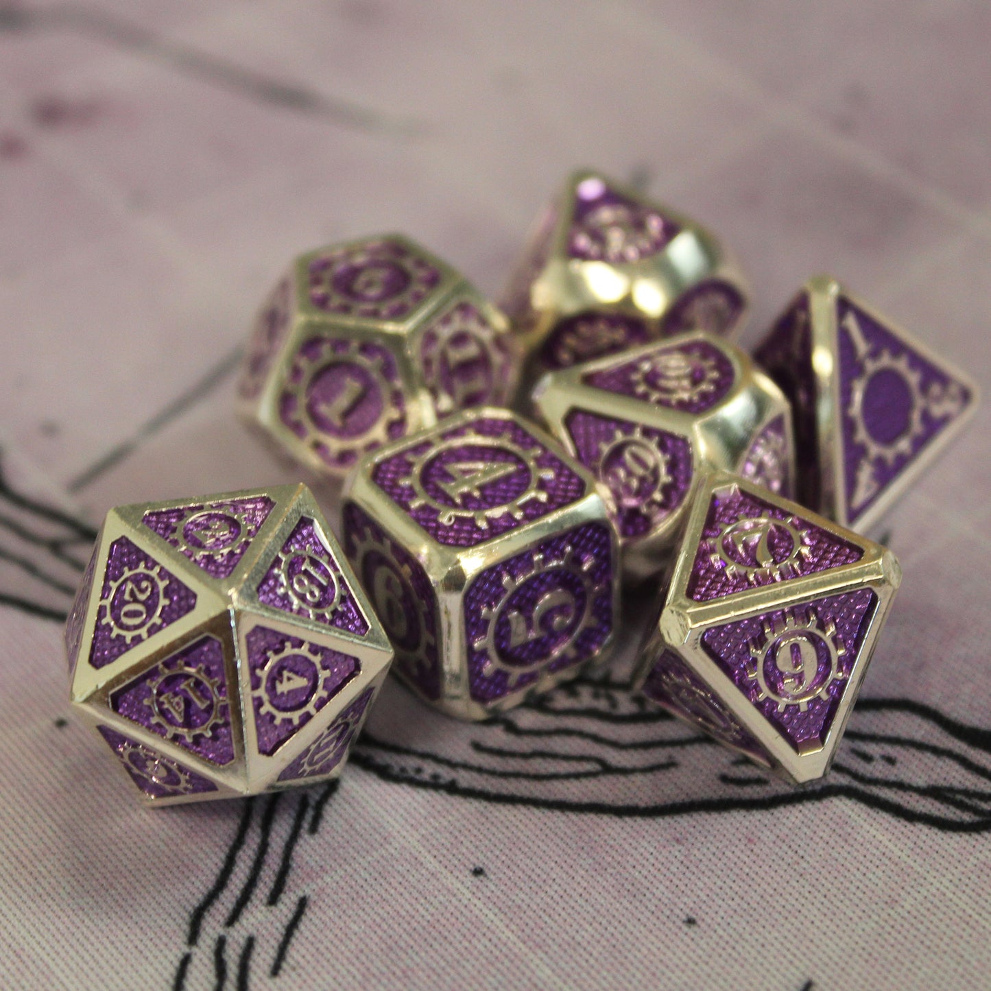 Mechanist dice set arranged in a pile on top of a white game mat.