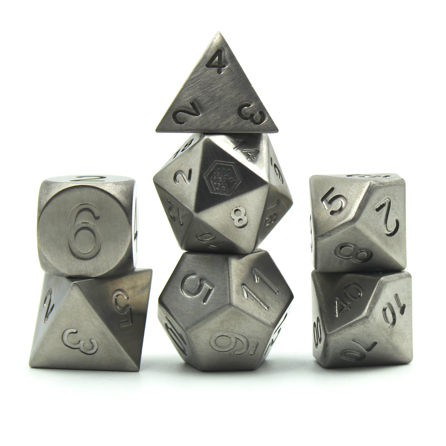 Metal Titanium dice set arranged in 3 columns on a white background and surface.  The 20 face of the d20 shows the Dice Dungeon logo instead of the numeral 20.  The dice are uniformly gray in color and the numbers do not have inking.