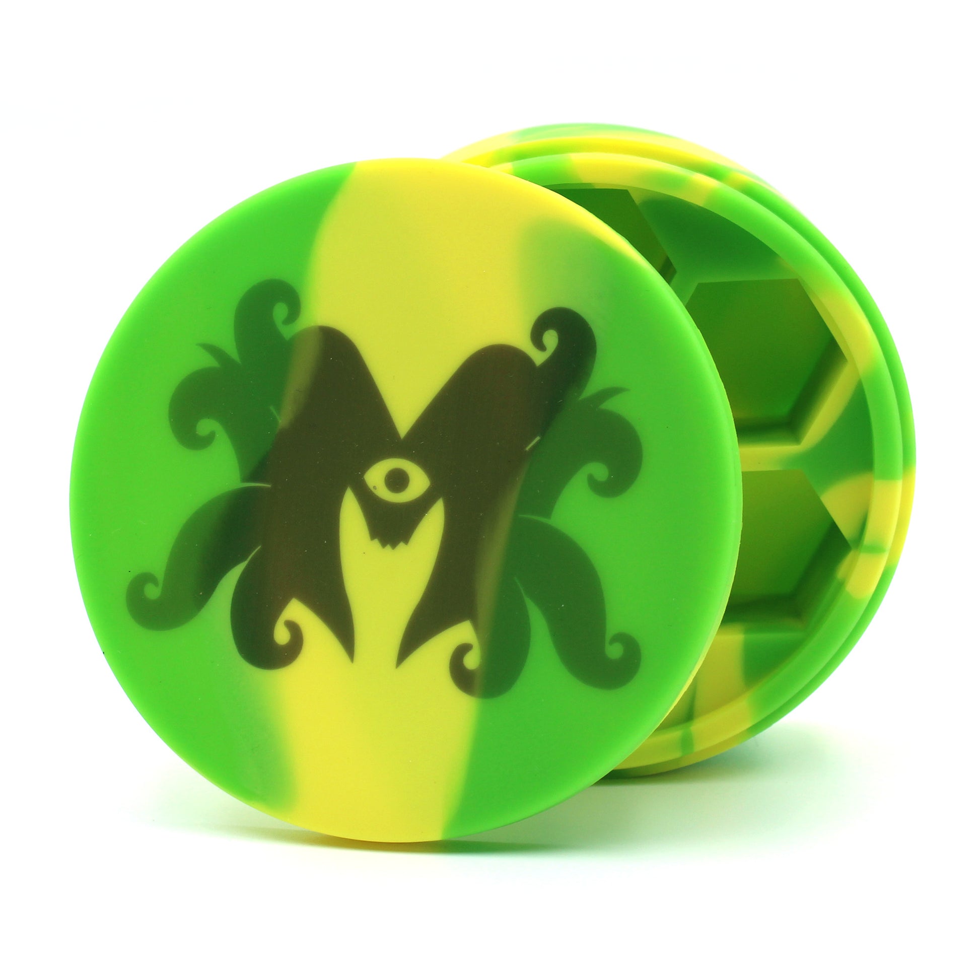 Silicone round dice case propped up and slightly open so that indentations where dice will go can be seen. Image on top of case is mutated monsters logo. Case has a lime green and yellow tie-dye effect. On a white background.