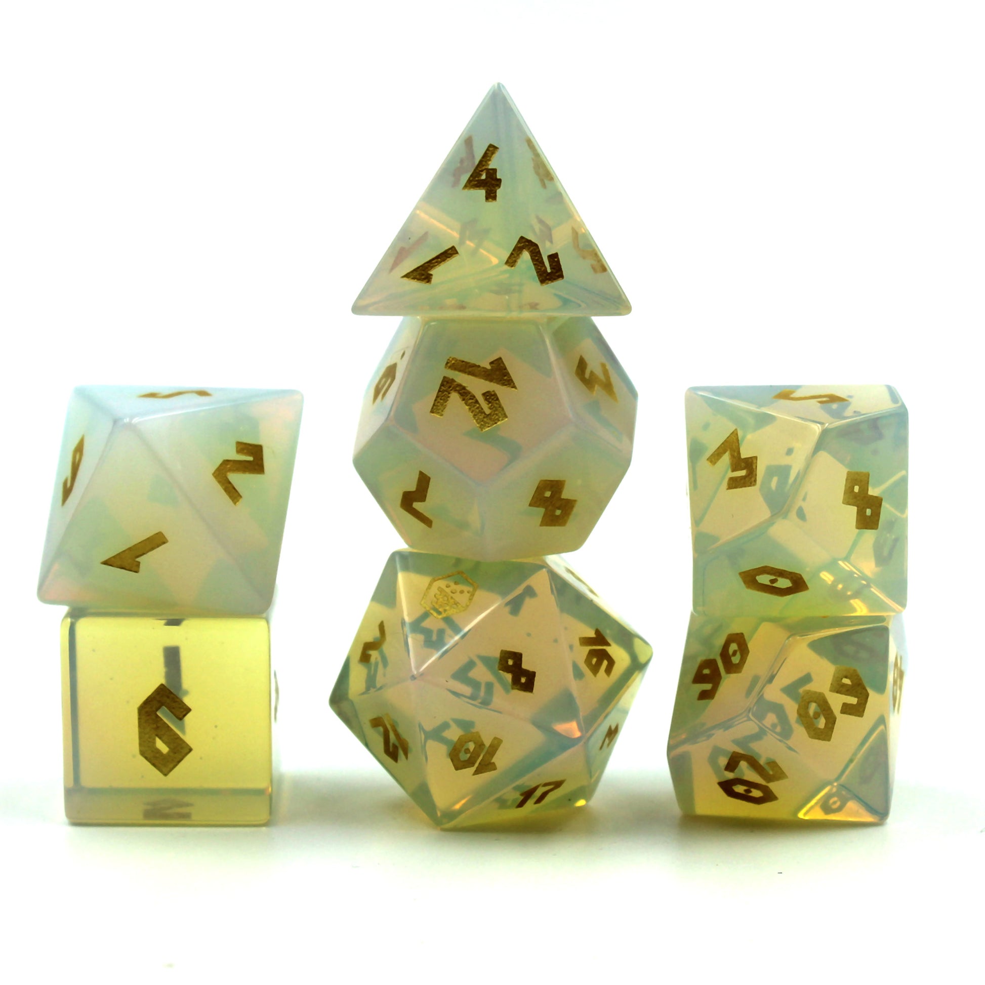 Stacked dice set in front of a white background, showcasing opalescent glow and gold numbering for tabletop RPGs.