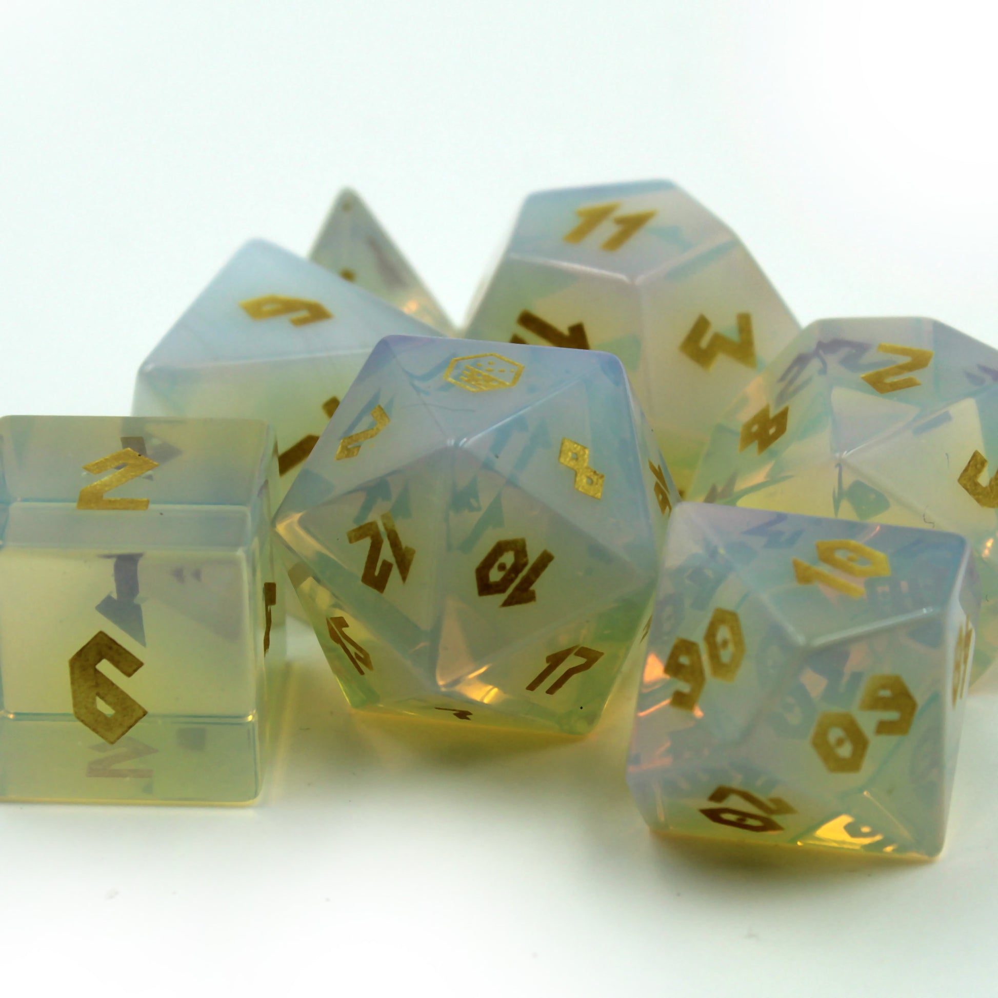 Dice set on white background under bright light, appearing to glow from within, adding luck to your DnD sessions.