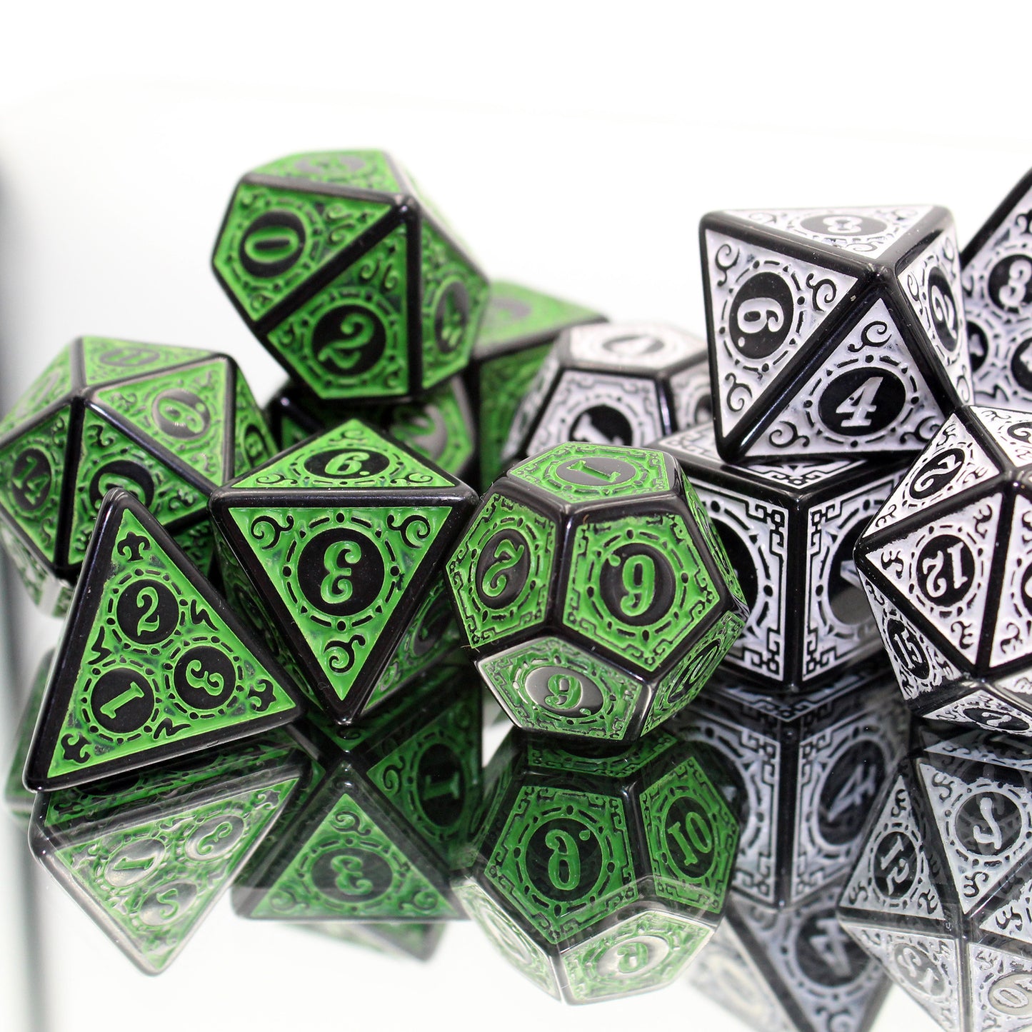 Oracle's Flame green dice set arranged in a pile on the left and Oracle's Flame white dice set arranged in a pile on the right, all on top of a reflective surface.
