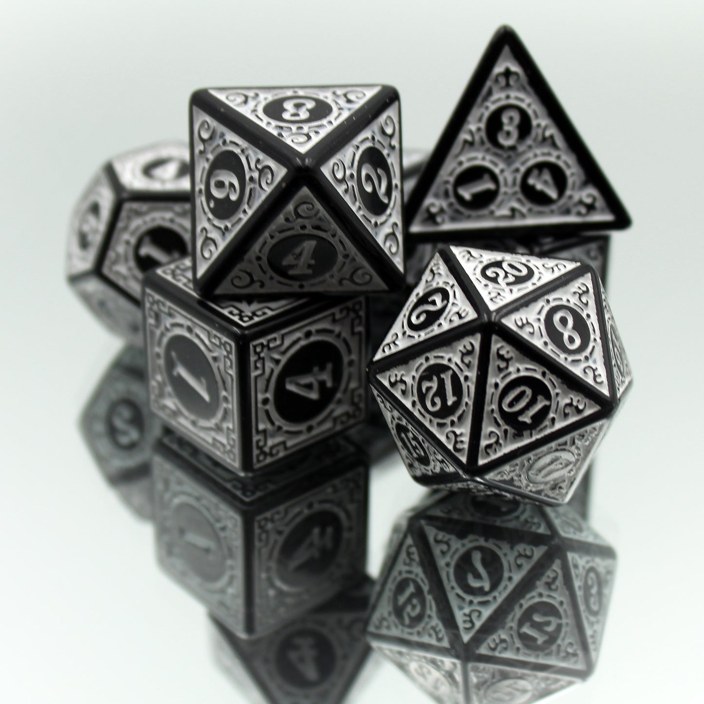 Oracle's Flame white dice set arranged in a pile on a reflective surface.
