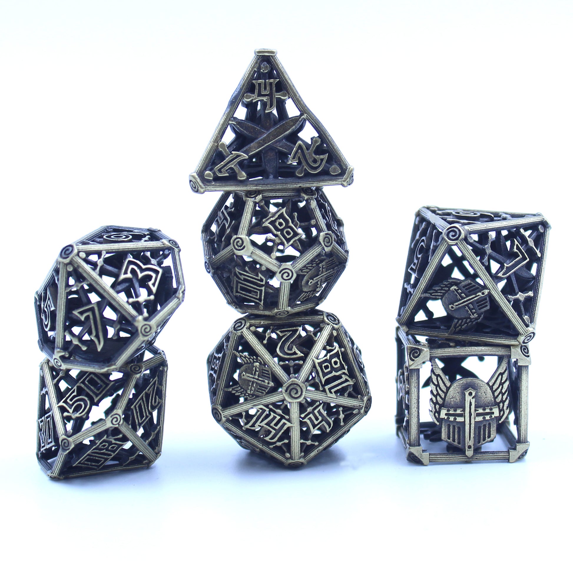 All 7 brass dice piled up in 3 stacks. Two dice in first stack, three dice in second stack, two dice in third stack. All on a white background.