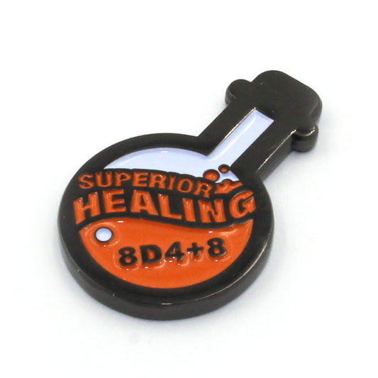 Potion of Superior Healing metal token laying flat on a white background, featuring the 8d4+8 healing value and enamel design.