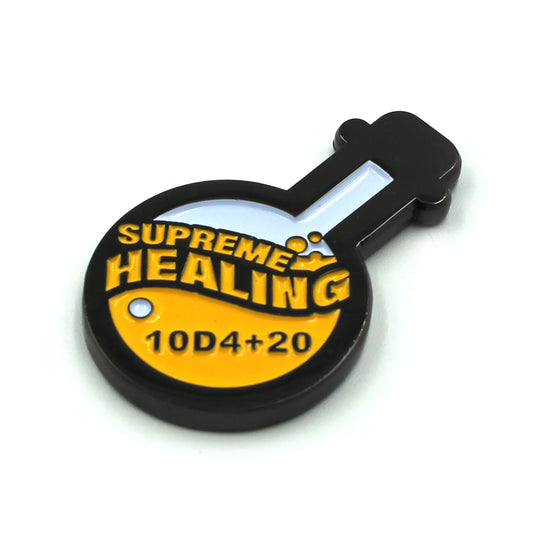 Potion of Supreme Healing Token on white surface. Token is shaped like a round bottom boiling flask, halfway filled with the design of yellow bubbly liquid and the words "supreme healing" written in yellow. On the liquid is the black lettering "10D4+20".