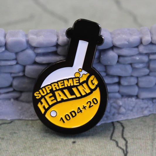 Potion of Supreme Healing token propped up on a gray stone wall set piece on top of a tan game map.