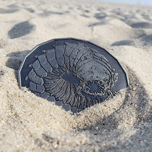 Purple Worm monster token displayed in sand, showcasing its gargantuan size and intricate burrowing beast artwork.
