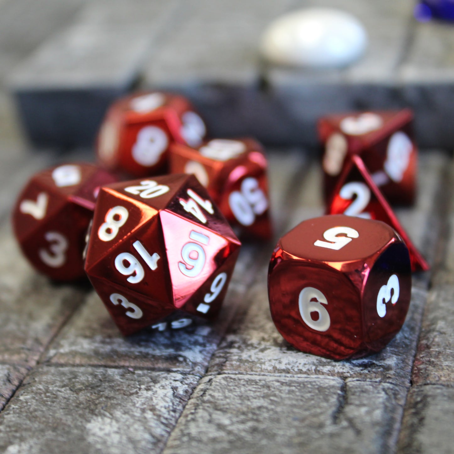 Radiant red dice set scattered on a stone floor set piece