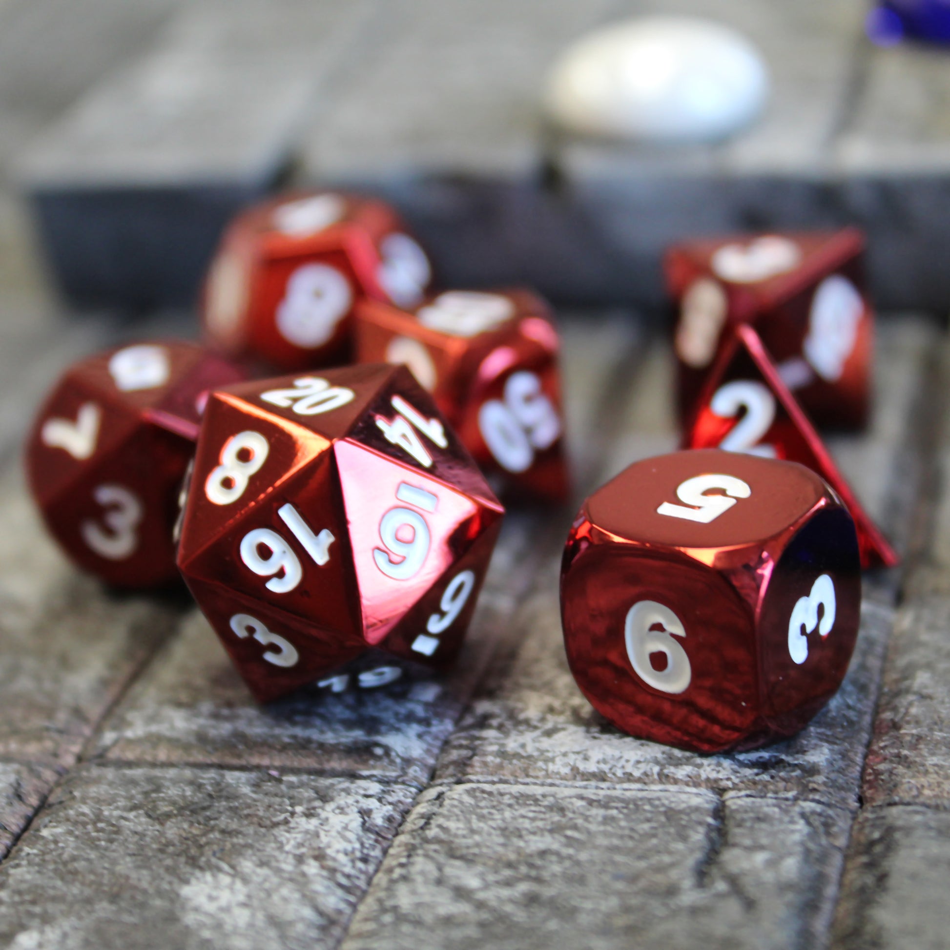 Radiant red dice set scattered on a stone floor set piece