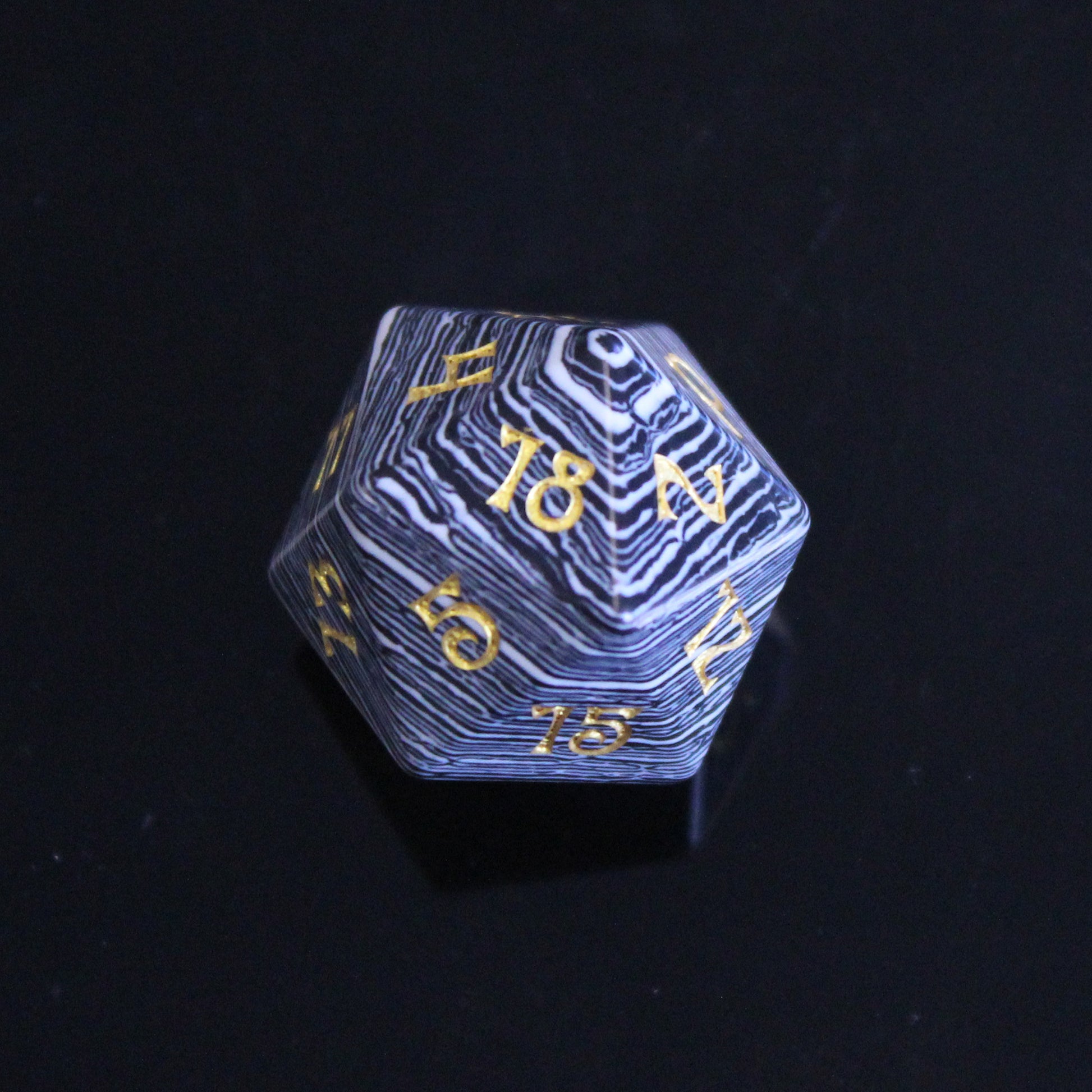Single 20-Sided Die with Black and White Stripes and Gold Numbering