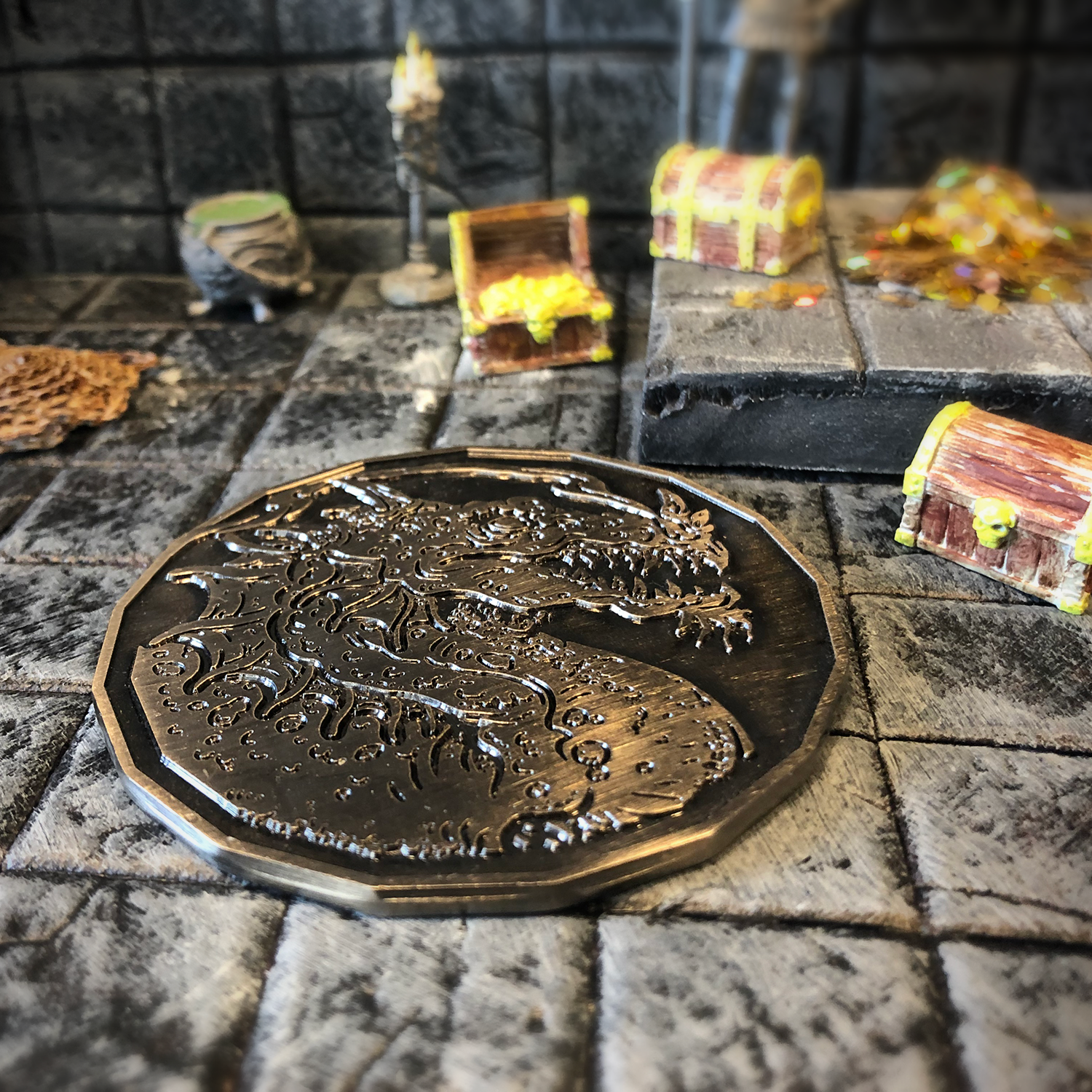 Close-up of the Adult Smoke Dragon token on a gaming table, surrounded by treasure tokens.