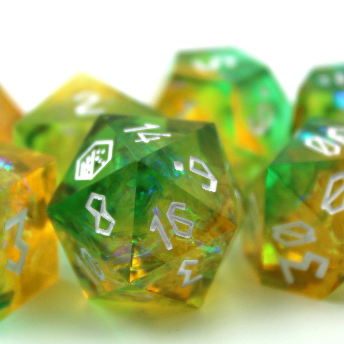 Close-up of the StarGlow Mutation Green D20 on a white background, highlighting the sharp edges and the transition between green and yellow with iridescent inclusions.