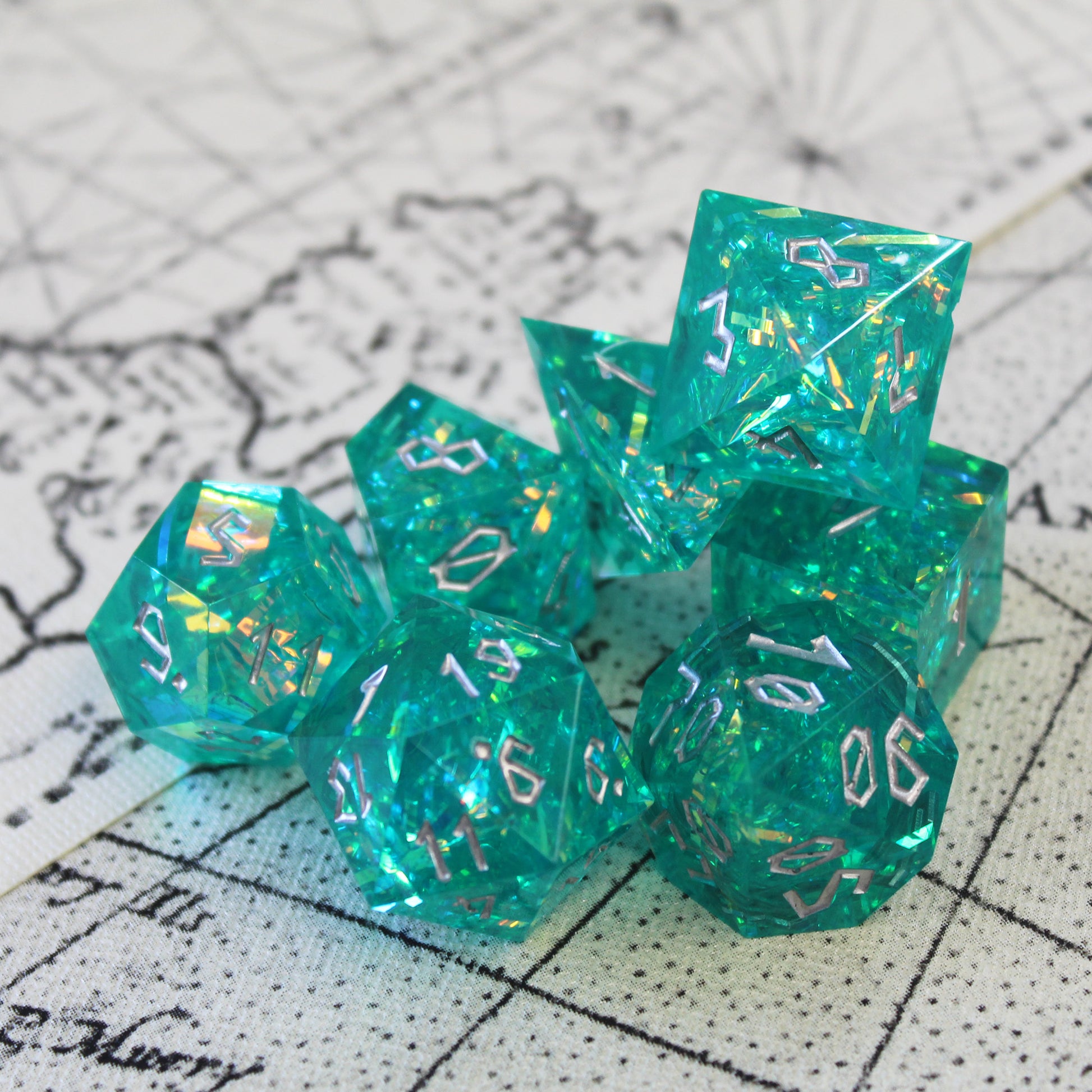 Turquoise sharp edge resin dice set for dungeons and dragons.