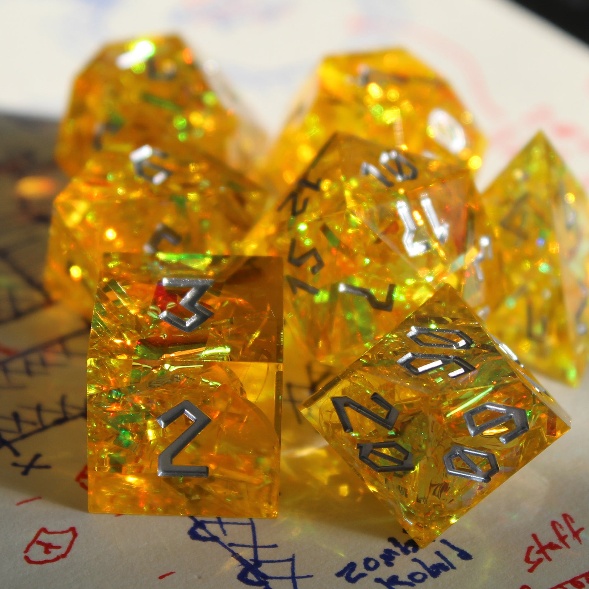 StarGlow Yellow sharp edge resin dice set, showcasing the translucent yellow resin and the sharp-edged design.