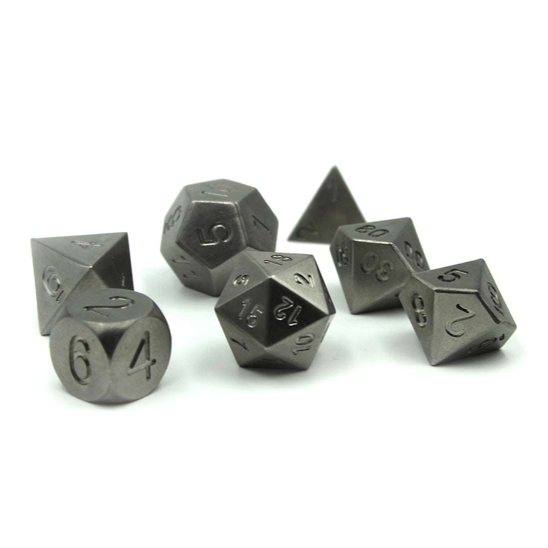 Metal Tungsten Heavy Dice Set resting on a white surface arranged with the d10s on the right and d20 center.  Tungsten has the highest melting point and lowest vapor pressure of all metals.