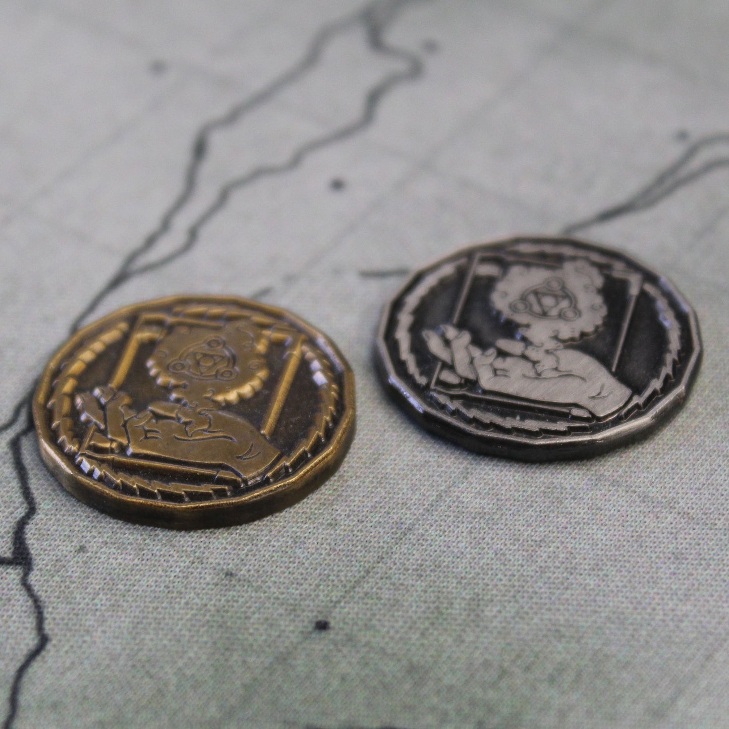 Wizard tokens in gold and silver with heads sides up