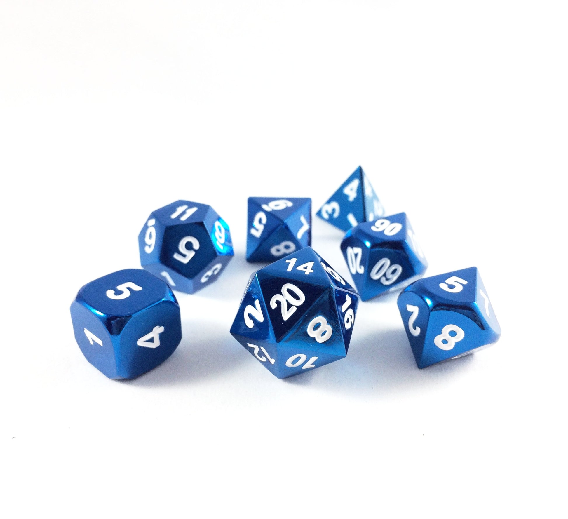 Radiant blue dice set scattered on a white background