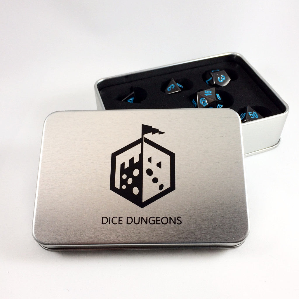 Metal Black Frost dice set arranged inside of a Dice Dungeons silver dice box. The box is opened with the lid leaning against the bottom so that the dice can be seen clearly.