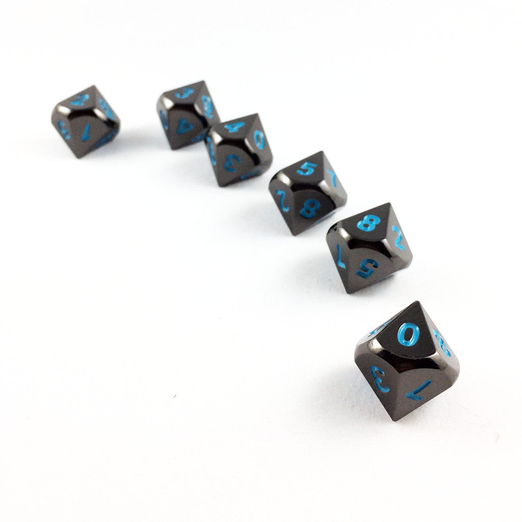 Metal Black Frost dice set arranged in a line on a white background