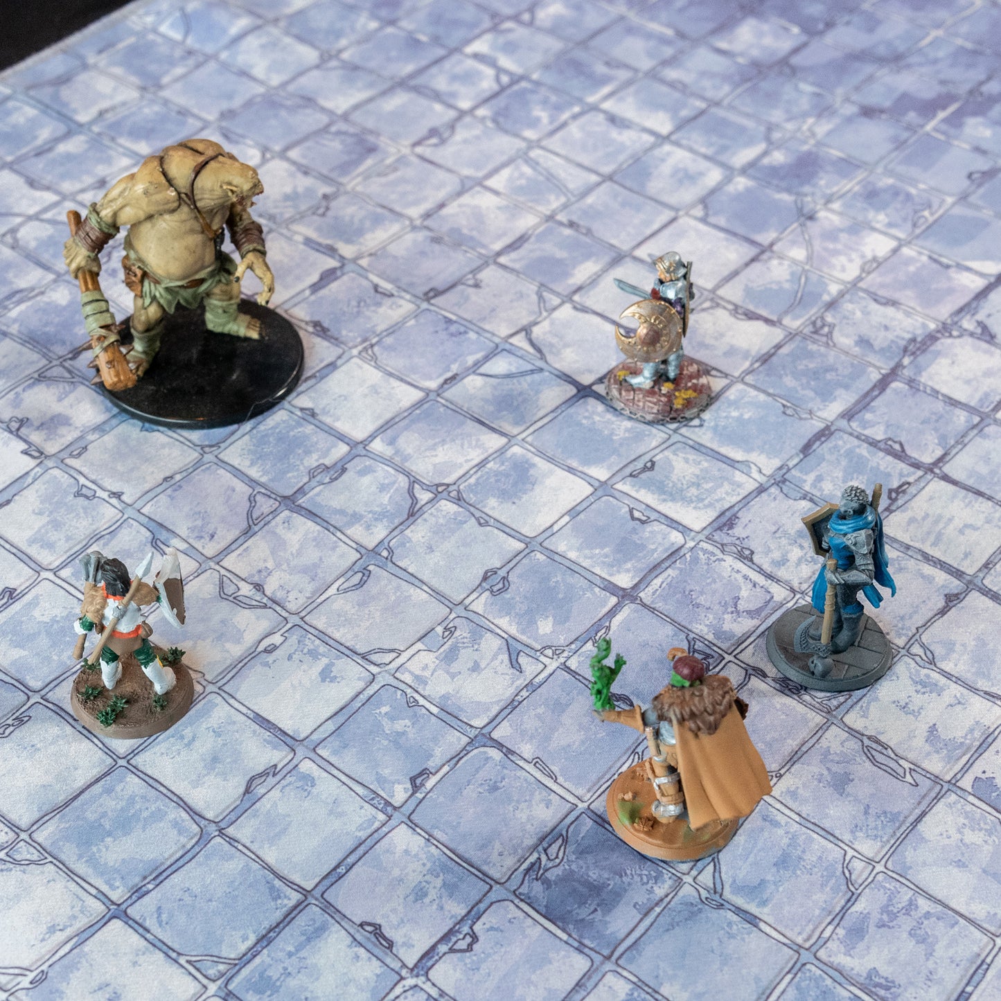 Isometric view of a castle floor battle map with various miniature figures on it