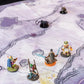 Close up photo of an adventuring party on a cave battle map