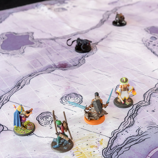 Close up photo of an adventuring party on a cave battle map