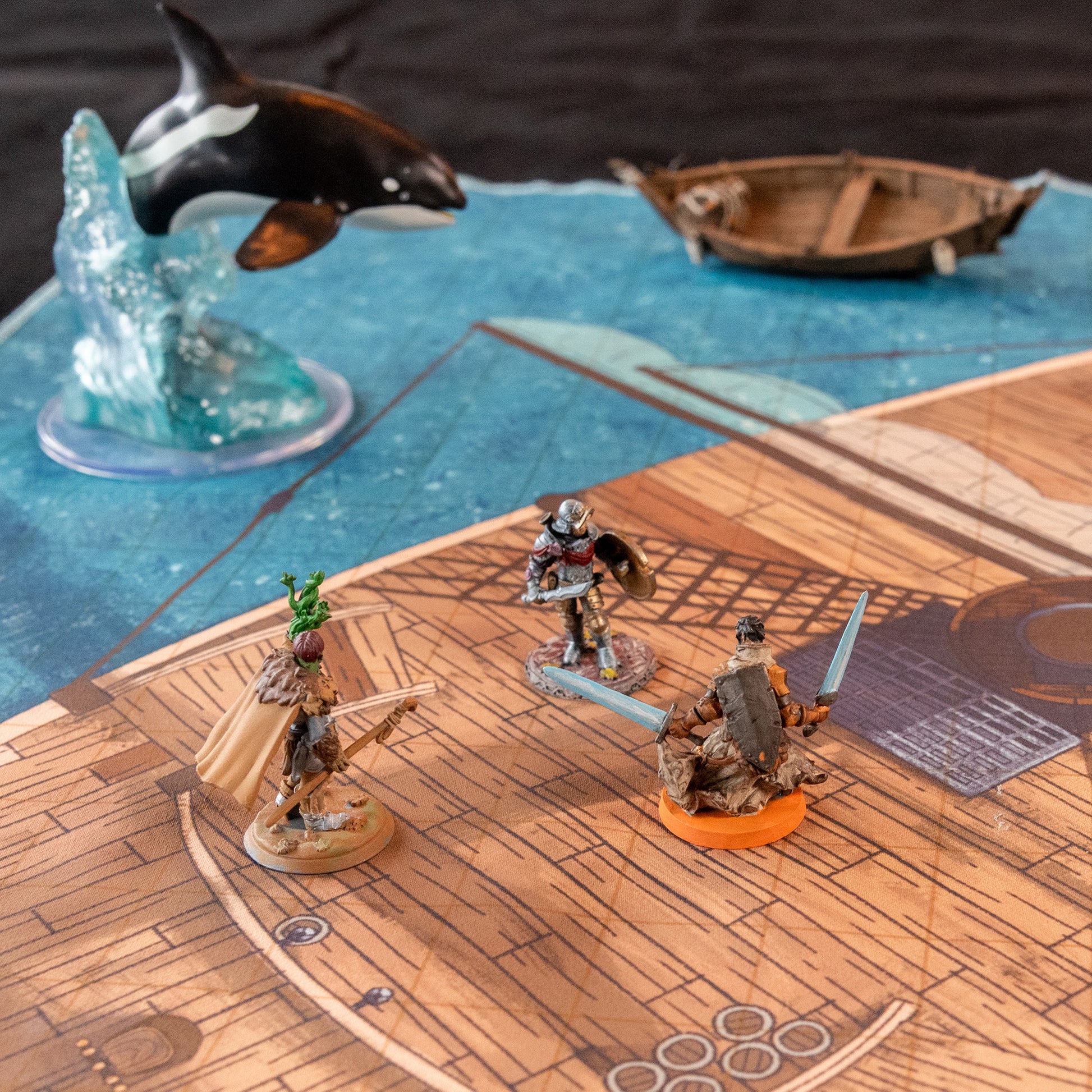 Photo of a battle map of a ship with various miniature figures placed on it