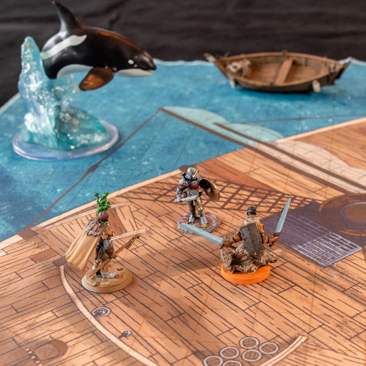 Photo of a battle map of a ship with various miniature figures placed on it