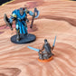 Closeup photo of a desert battle map with two miniature figures on it