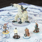 Closeup photo of a snowy battle map with various miniature figures on it