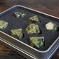 Jade dice set displayed in its deluxe box.