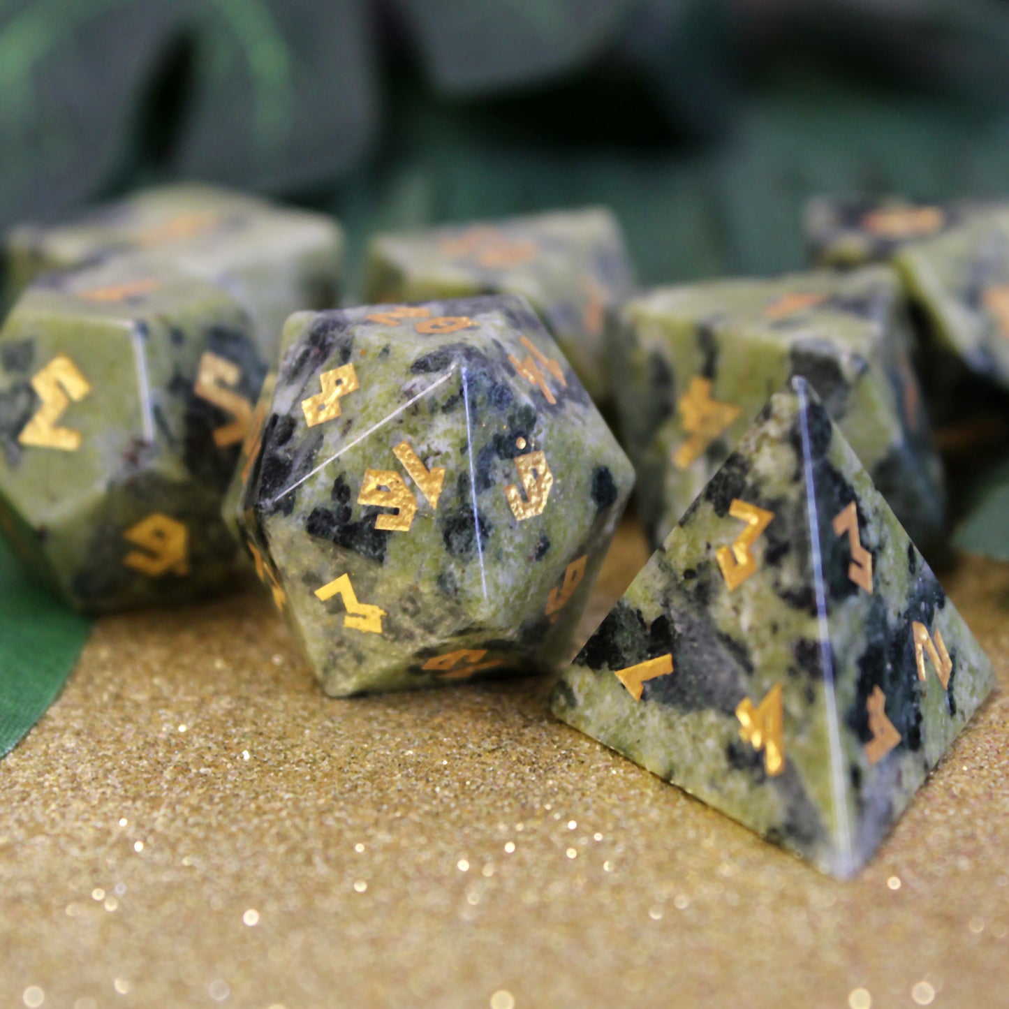 Close-up of the Brazilian Jade dice set, showcasing the rich green color of the jade and luxurious gold numbering.