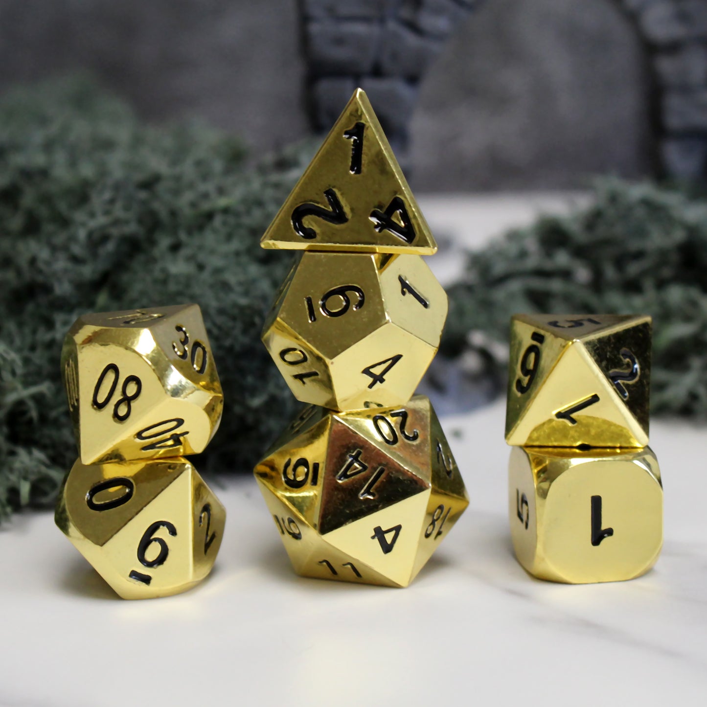 Stacked Metal Bright Gold Dice Set showcasing lustrous shine and elegant design for DnD and tabletop RPGs.