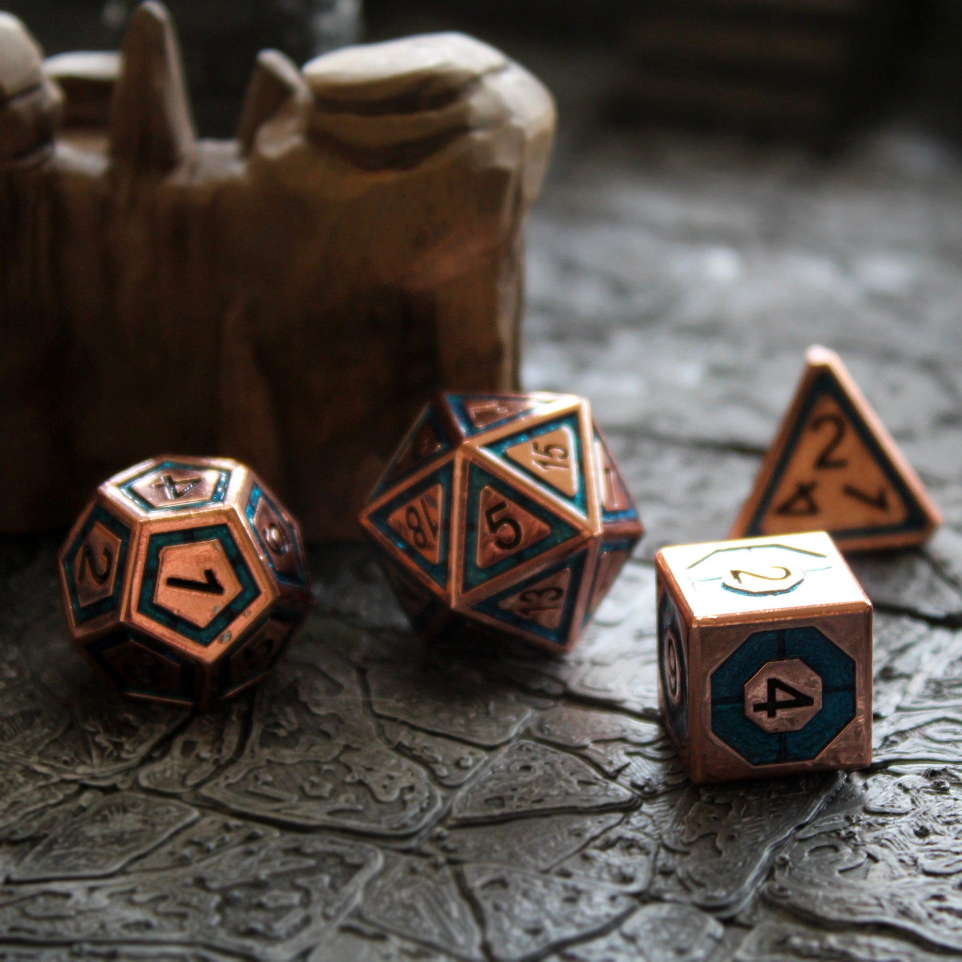 BullsEye Blue dice on a cave tile background taken during a session of D&D at Dice Dungeons. The d6 features an octagon ring thicker than the outside ring of other dice of this set.