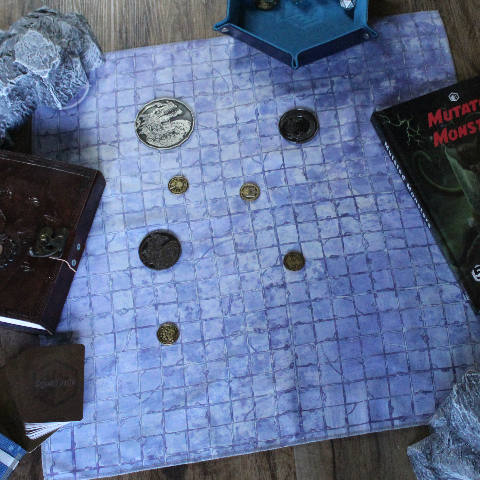 Image of a castle floor battle map with various metal tokens on it.