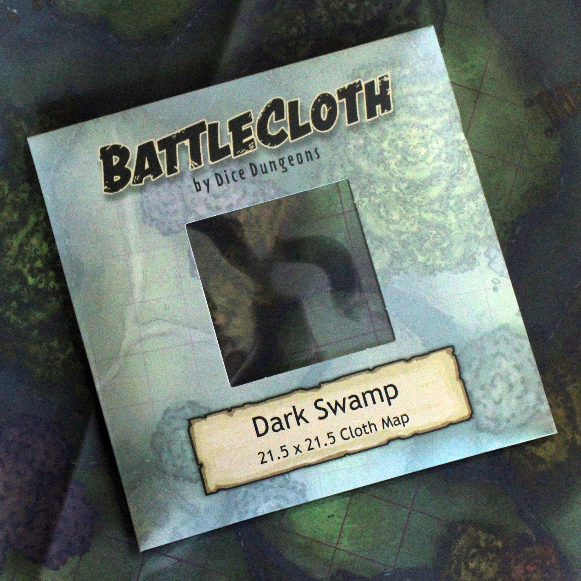 Photograph of packaging that reads "Battlecloth by Dice Dungeons, Dark Swamp"