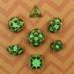 Overhead view of the full green dragon scale dice set, showing all dice types included for Dungeons and Dragons.