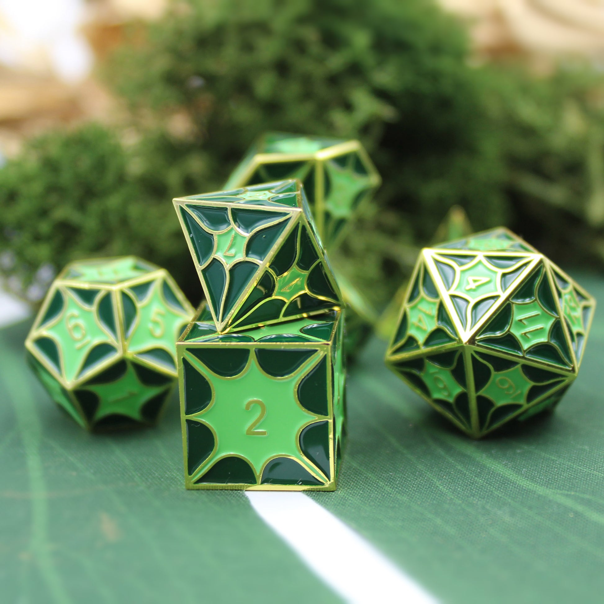 Green dragon scale dice set arranged on a table, perfect for Dungeons and Dragons sessions.