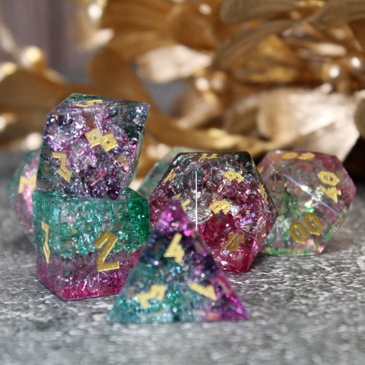 Fae Friend Shattered Glass dice set with pink and green tones, designed to reflect light through the fine fissures in the glass.