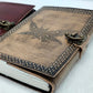 Leather-bound notebook with mothman design and metal clasps on a white background