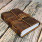 Leather bound journal with a strap that is perfect for notes in any TTRPG campaign setting 