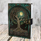 Green, gold, and black leather Dungeons & Dragons journal featuring an embossed world tree design for tabletop RPG note-taking